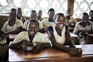 Benin, Couffo, Toviklin, Agbedoum village, May 2011 Mtohou Primary School Present in Benin since 1964, the World Food Programme (WFP) is supporting the Government of Benin in achieving the Millennium Development Goals of Ending Poverty and Hunger, Universal Education and Gender Equality through its School Feeding Programme. Primary education is a priority for the Government, which is committed to providing universal primary education by 2015. Under the current operation, WFP is providing a daily hot meal to over 103,000 children in 364 schools in poor rural areas. The objective is to increase the enrollment and attendance rates in targeted districts, particularly for girls. The number of schools assisted will decrease over the course of the intervention, with a gradual handover of canteen management from WFP to the Government school feeding programme. Government capacity building for management of school canteens is a core aspect of the new projectÕs strategy and one of the fundamental objectives of the project. WFP will provide technical assistance to the Government of Benin in order to support the establishment and functioning of a national school feeding programme that will eventually be able to take over completely from WFP In the photo: Emile Meto is 12 years old; he has two brothers and four sisters. His father recently passed away and now the mother is in charge of supporting the entire family. She took over the family fields and is a farmer, providing her family with the food and selling whatever is left over. Emile and his family live in a house made of cement blocks, which is very rare in Benin, although they have no furniture, and they sleep on the floor without even a mat or mosquito nets. EmileÕs house is not very far from the school and he usually walks there with his brothers and sisters. Before going to school he helps his mother in the field, so he has to wake up very early. He enjoys reading and writing stories and one day he dream