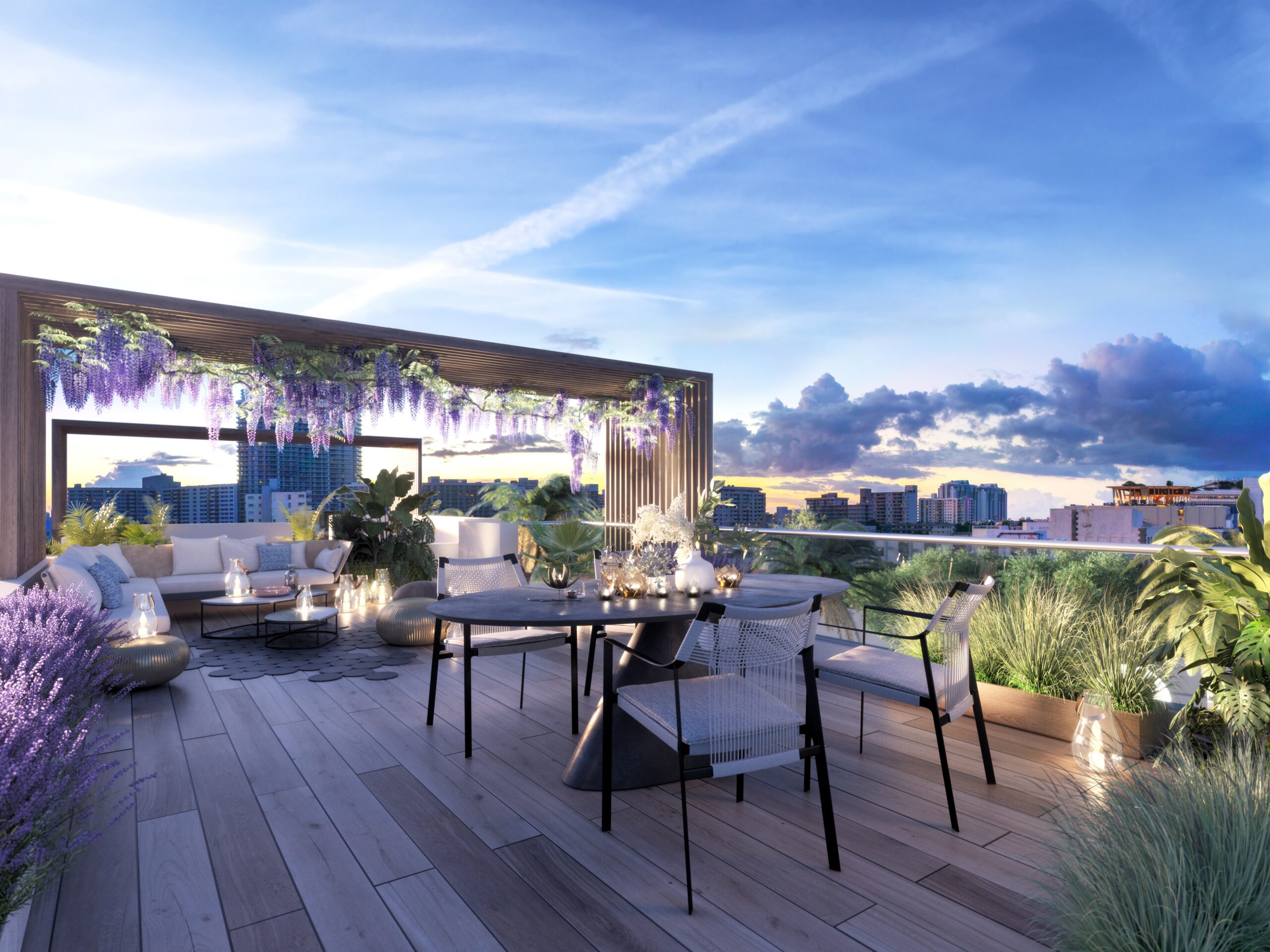 Modern rooftop terrace with seating and city views at sunset.