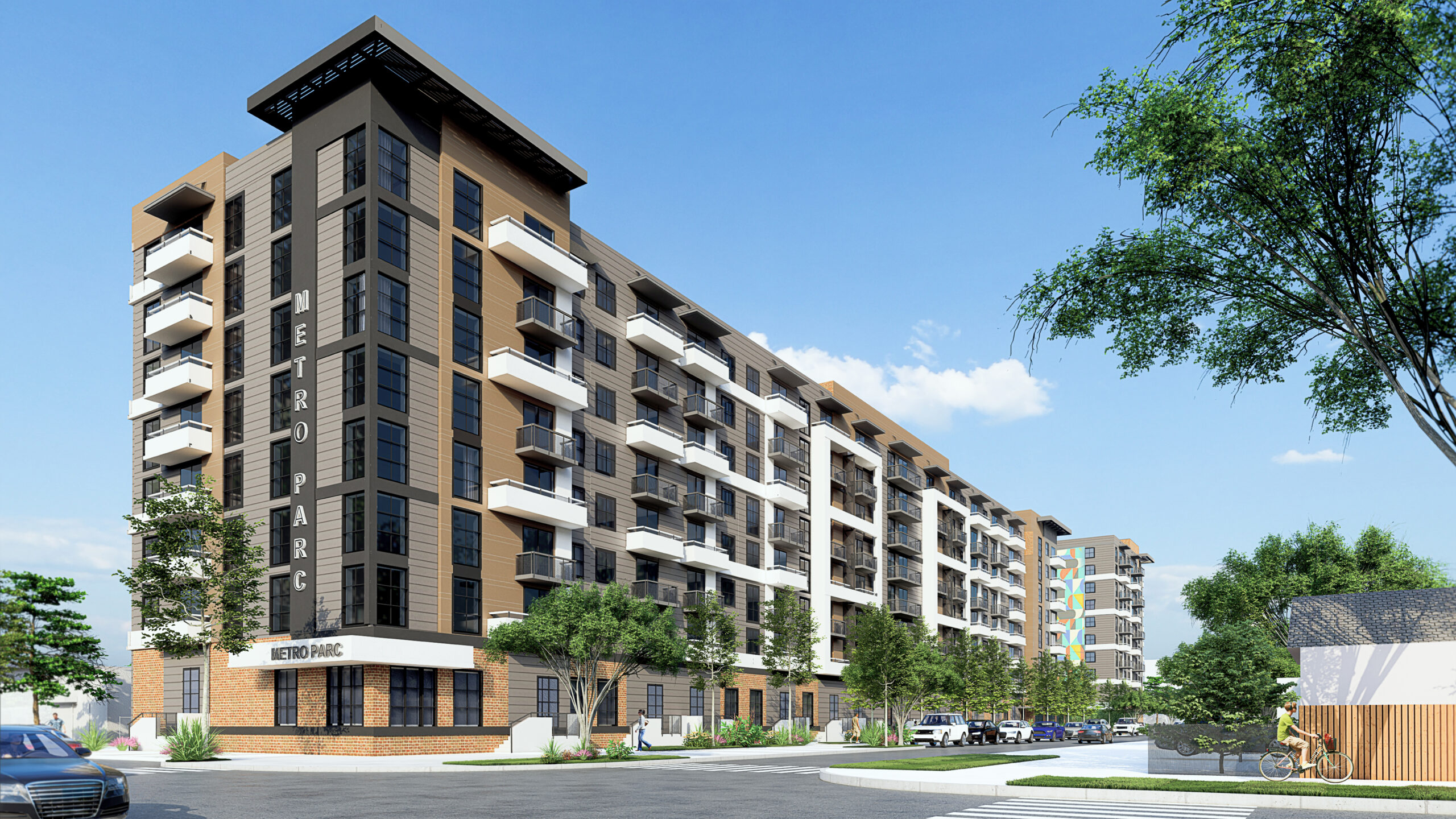 Modern multi-story residential apartment building under a clear blue sky.