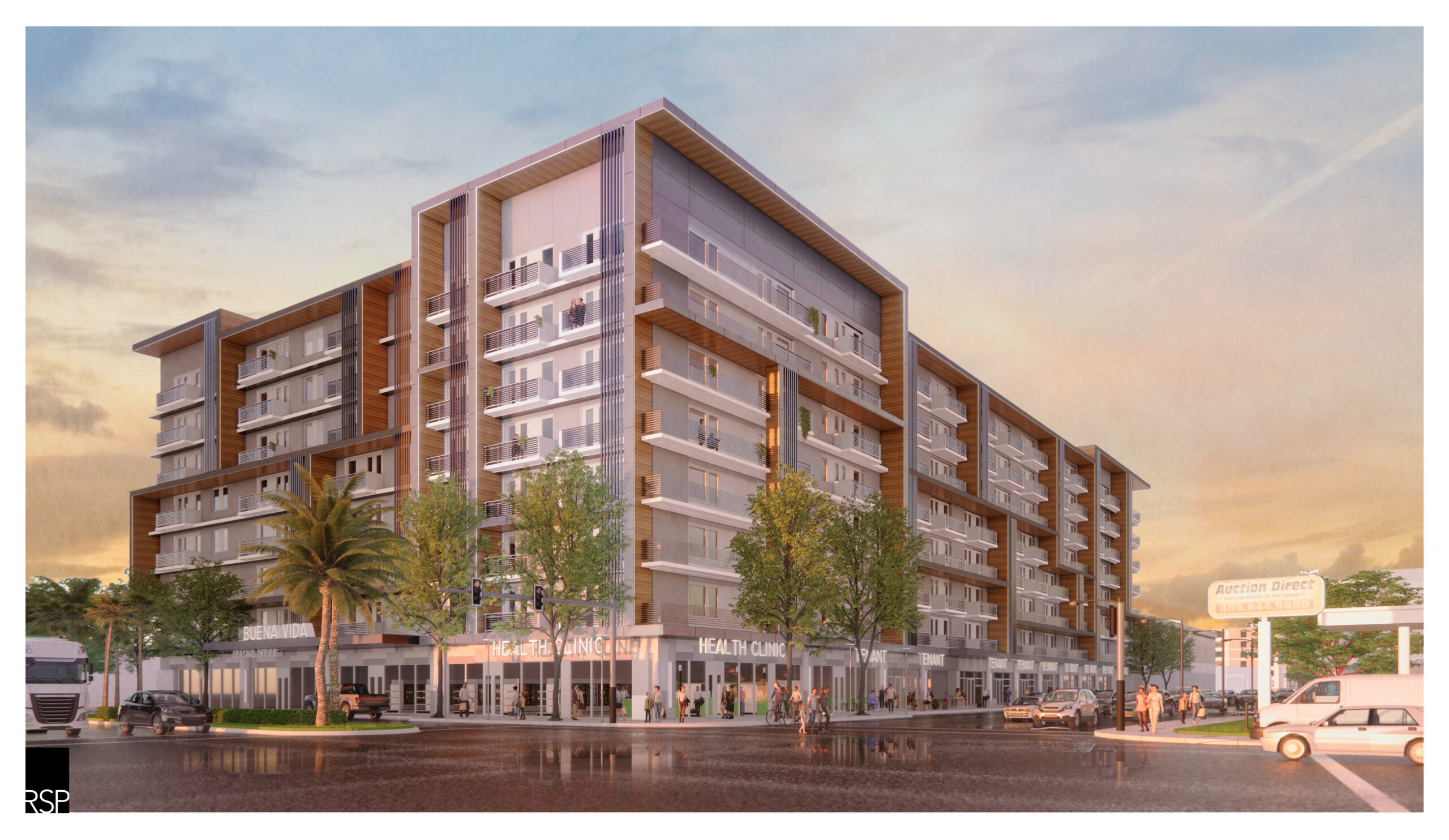 Modern multi-story apartment building with retail shops at street level during sunset.