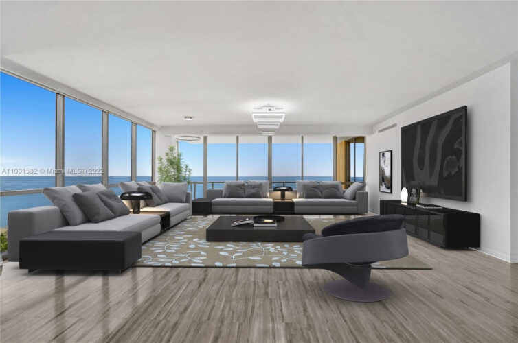 Modern living room with panoramic city views and elegant furnishings.