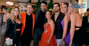 Five people dressed elegantly at a formal event.