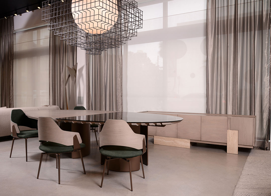 Elegant dining area with modern chairs and a geometric chandelier.