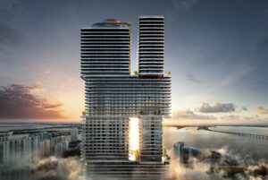 Modern twin skyscrapers with a sunset view and reflective glass facade.