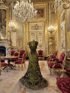Luxurious vintage room with ornate gold details and elegant furnishings.