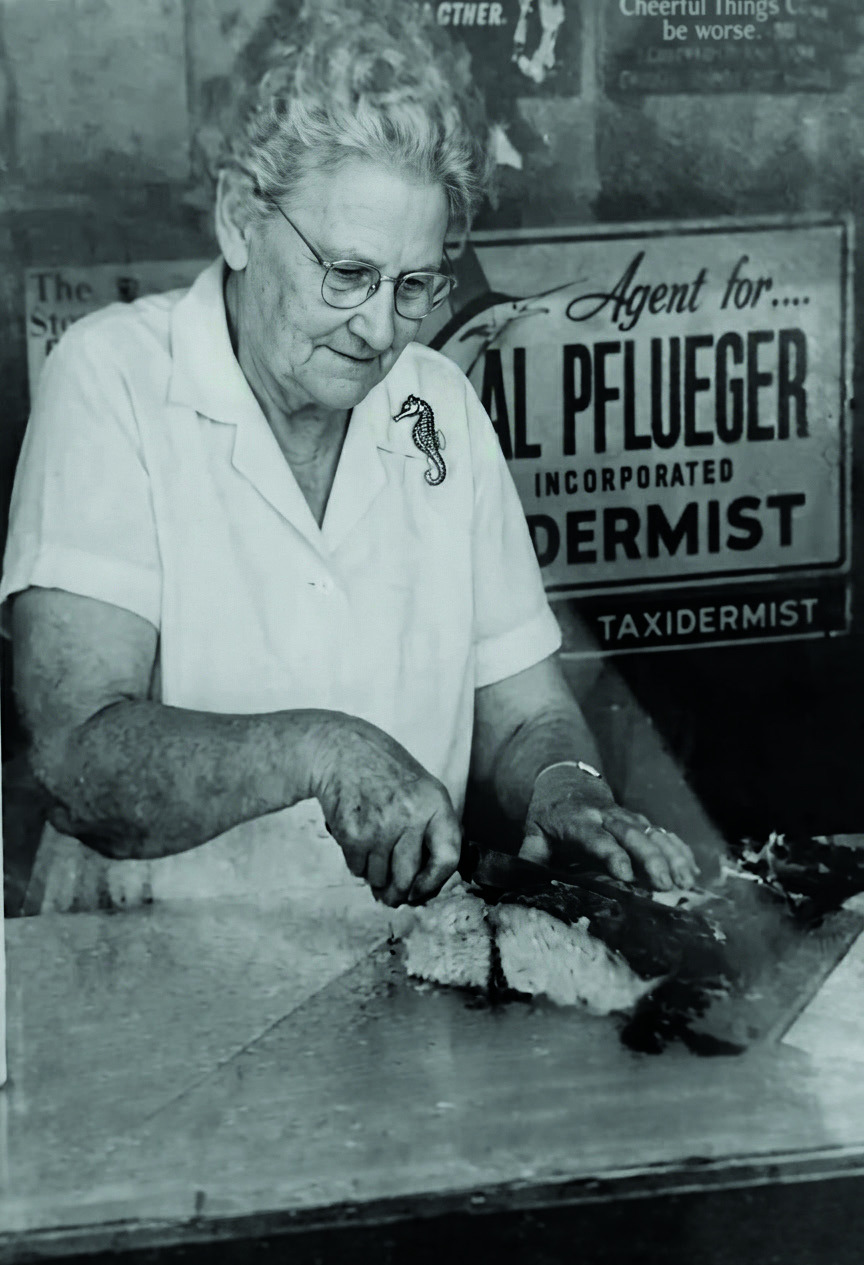 Sally Peters, founder of Mrs. Peters Smokehouse, filleting fish