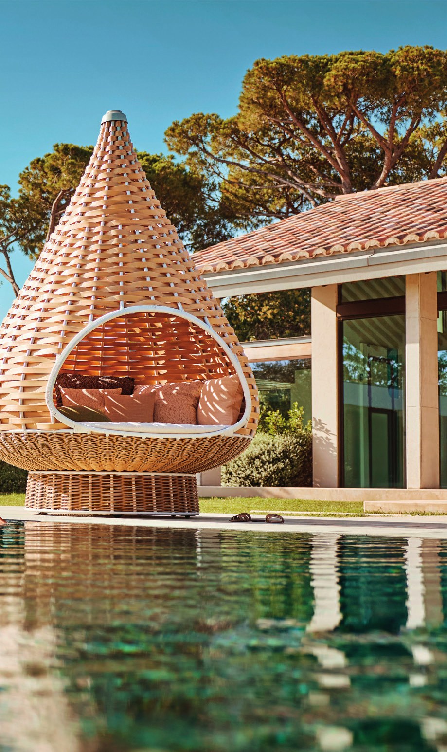 Dedon Nestrest woven lounger by the pool