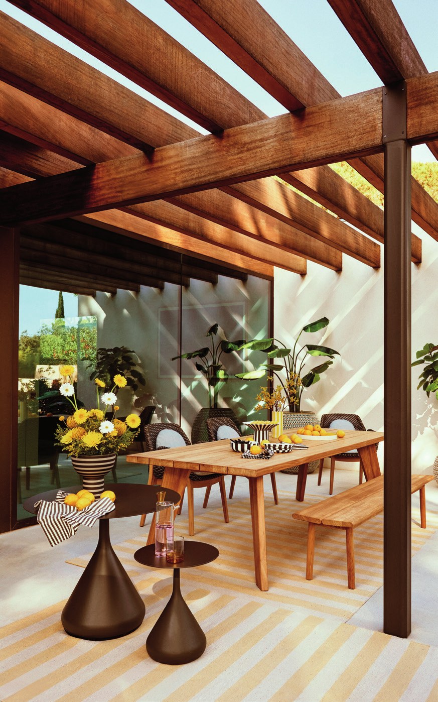 Outdoor dining under a wooden pergola