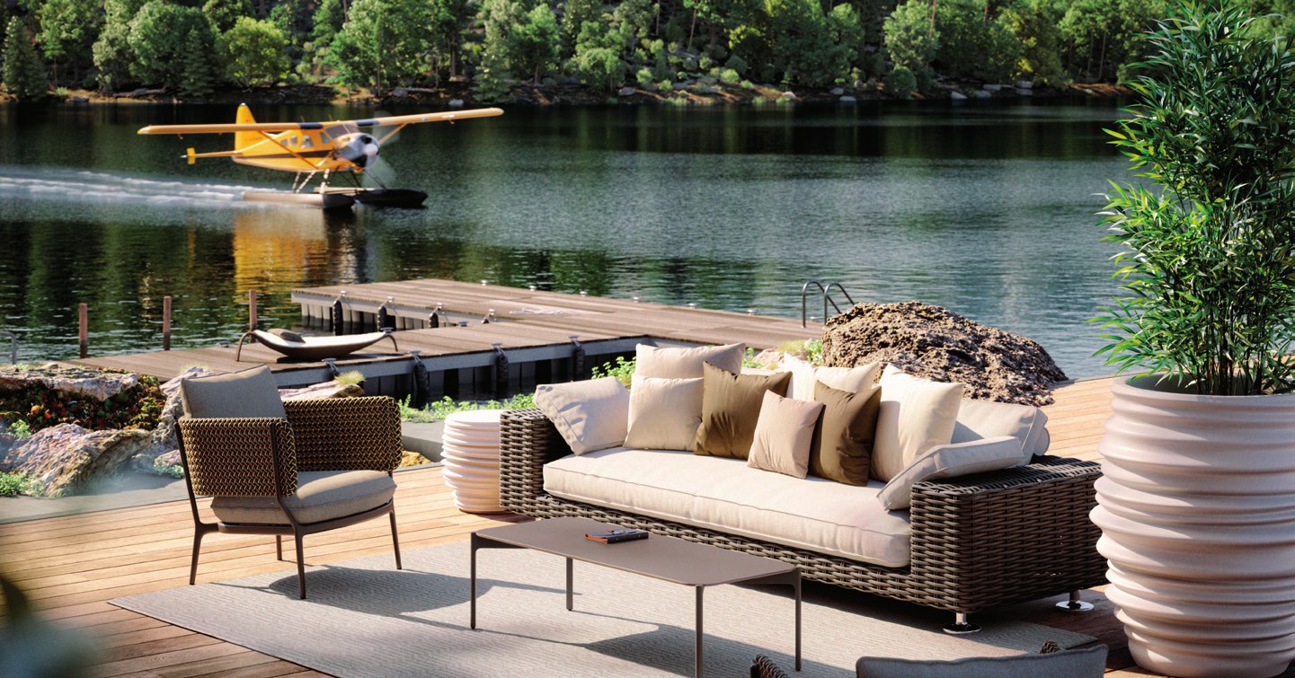 Woven outdoor sofa on a lakeside deck