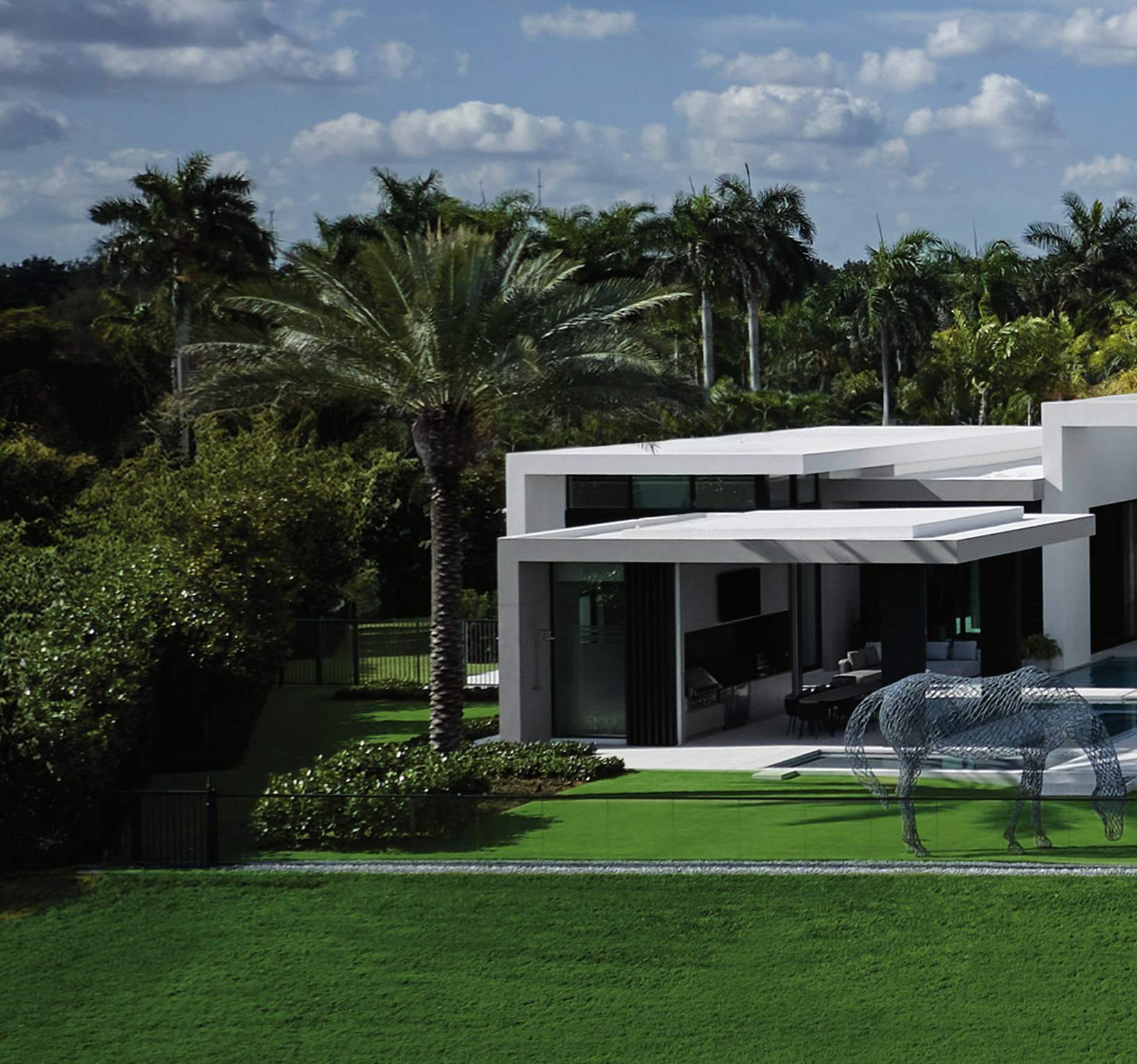 Modern estate by Choeff Levy Fischman surrounded by palms