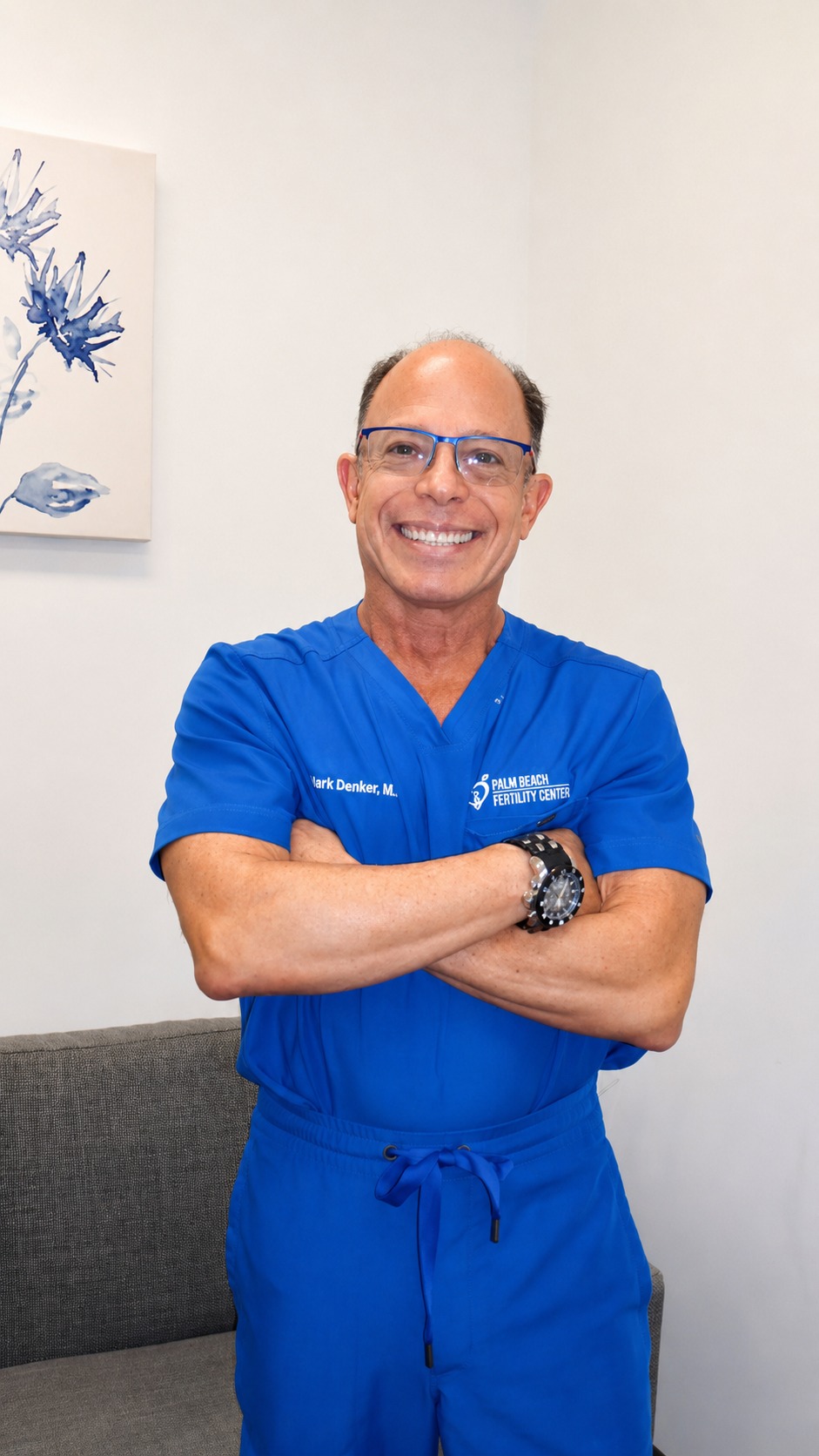 Dr. Mark S. Denker in blue scrubs