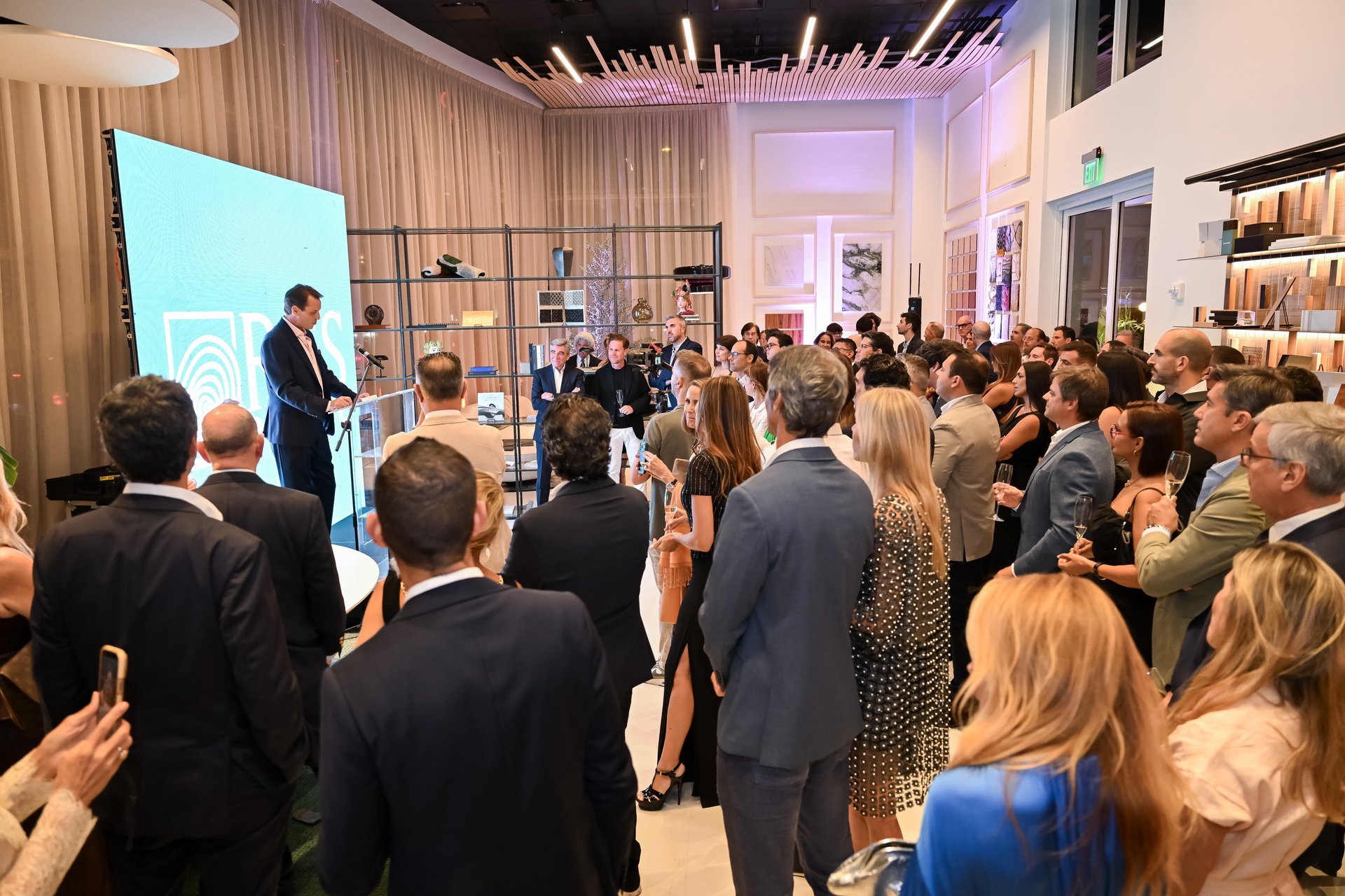 Guests fill the new RGS Europe showroom in Coral Gables for the grand opening speeches