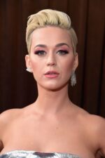 Close-up of a woman with elegant makeup and earrings.