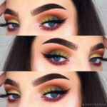 Vibrant blue and orange eye makeup with bold brows.