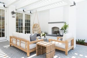Bright, modern living room with natural wood furniture and cozy fireplace.