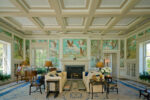Elegant living room with tropical-themed wallpaper and classic furnishings.