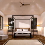Elegant bedroom with a four-poster bed and warm lighting.