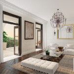 Elegant living room with modern furniture and chandelier overlooking a patio.