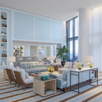 Bright and modern living room with large windows and comfortable seating.