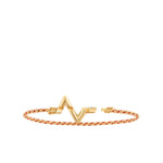 Elegant gold bracelet with a heartbeat design and orange cord.