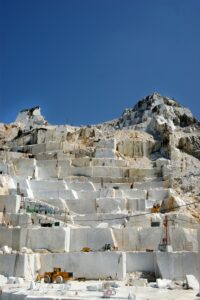 A rocky, stepped mountain under a clear blue sky.