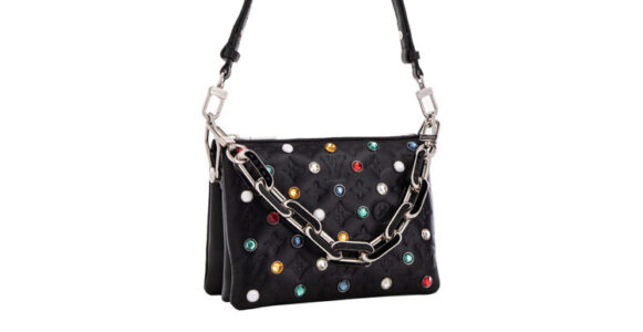 Black handbag with colorful studs and a silver chain strap.