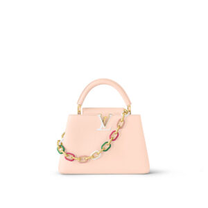 Elegant pink handbag with a colorful flower chain strap.