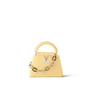 Elegant yellow handbag with chain detail on white background.