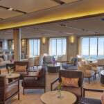 Elegant lounge with comfortable seating and ocean views.