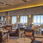 Elegant lounge with comfortable seating and ocean views.