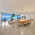 Spacious modern living and dining area with ocean views.