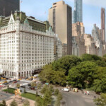 https://www.accorhotels.com/A568 A sunny day view of Central Park and surrounding skyscrapers in New York City.