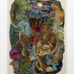 Intricately carved and painted wooden art featuring a tiger in a vibrant natural setting.