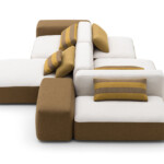Modern modular sofa with white and brown cushions and mustard accents.