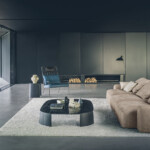 Modern living room with minimalist furniture and neutral tones.
