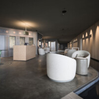 ©AlexFilz . Adler Sicily 2022 Modern living room with minimalist furniture and soft lighting.