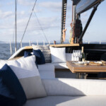 Luxurious outdoor seating area on a yacht with ocean views.