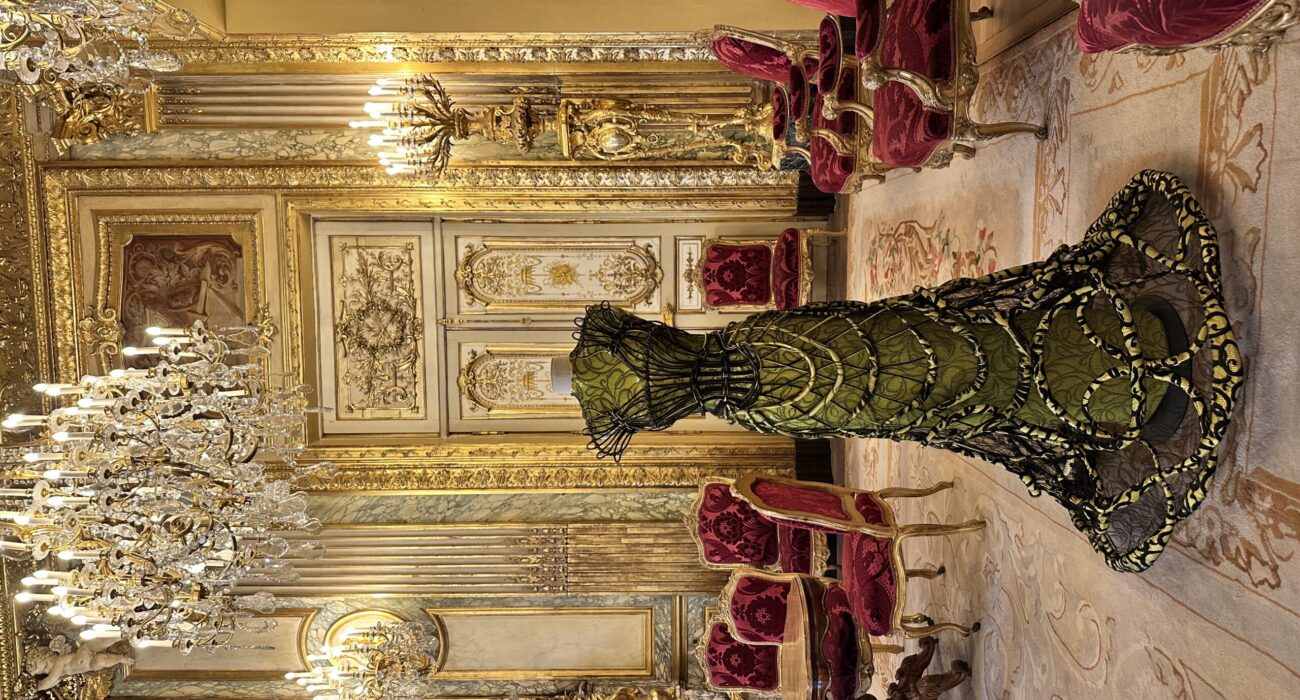 Luxurious vintage room with ornate gold details and elegant furnishings.